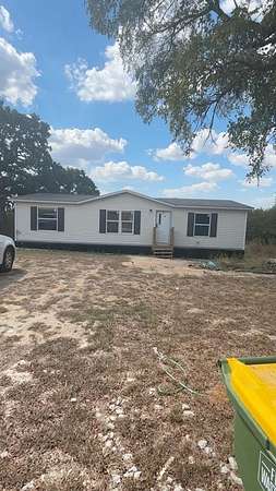 2 Acres of Residential Land with Home for Sale in Covington, Texas