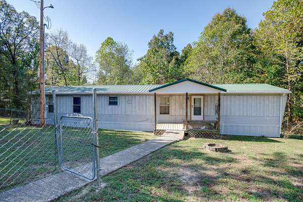 5 Acres of Residential Land with Home for Sale in Palmyra, Tennessee