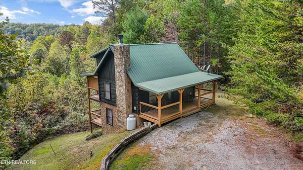 4.4 Acres of Residential Land with Home for Sale in Sevierville, Tennessee