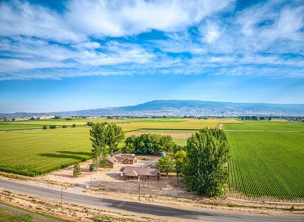 170 Acres of Agricultural Land with Home for Sale in Delta, Colorado