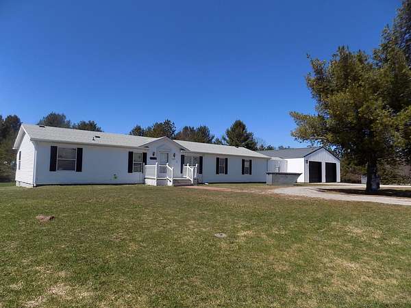 10 Acres of Recreational Land with Home for Sale in Hillman, Michigan