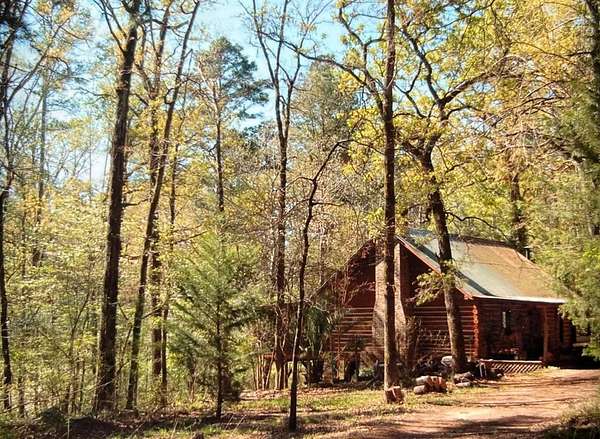 56.4 Acres of Recreational Land with Home for Sale in Grapeland, Texas