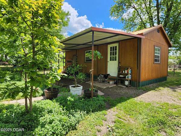 0.9 Acres of Residential Land with Home for Sale in Lamar, Missouri