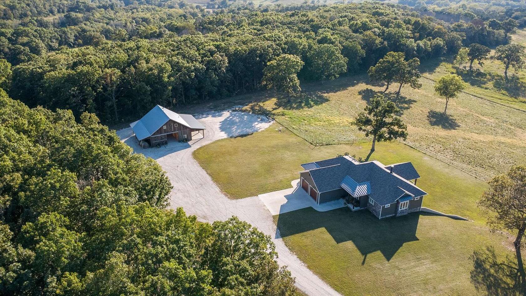 125 Acres of Agricultural Land with Home for Sale in Stockton, Missouri