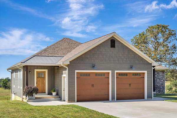 125 Acres of Agricultural Land with Home for Sale in Stockton, Missouri