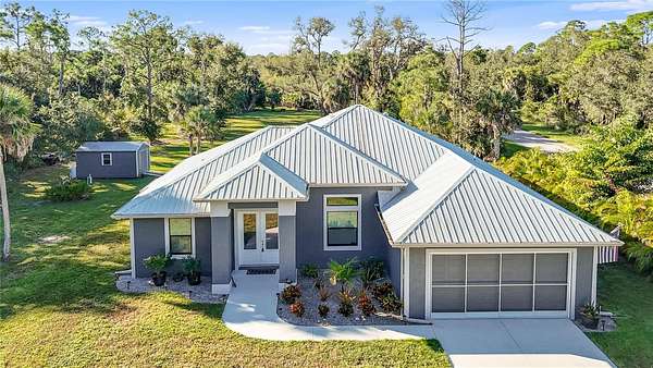 1.7 Acres of Residential Land with Home for Sale in Port Charlotte, Florida