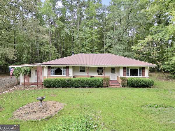 10.7 Acres of Land with Home for Sale in Jackson, Georgia
