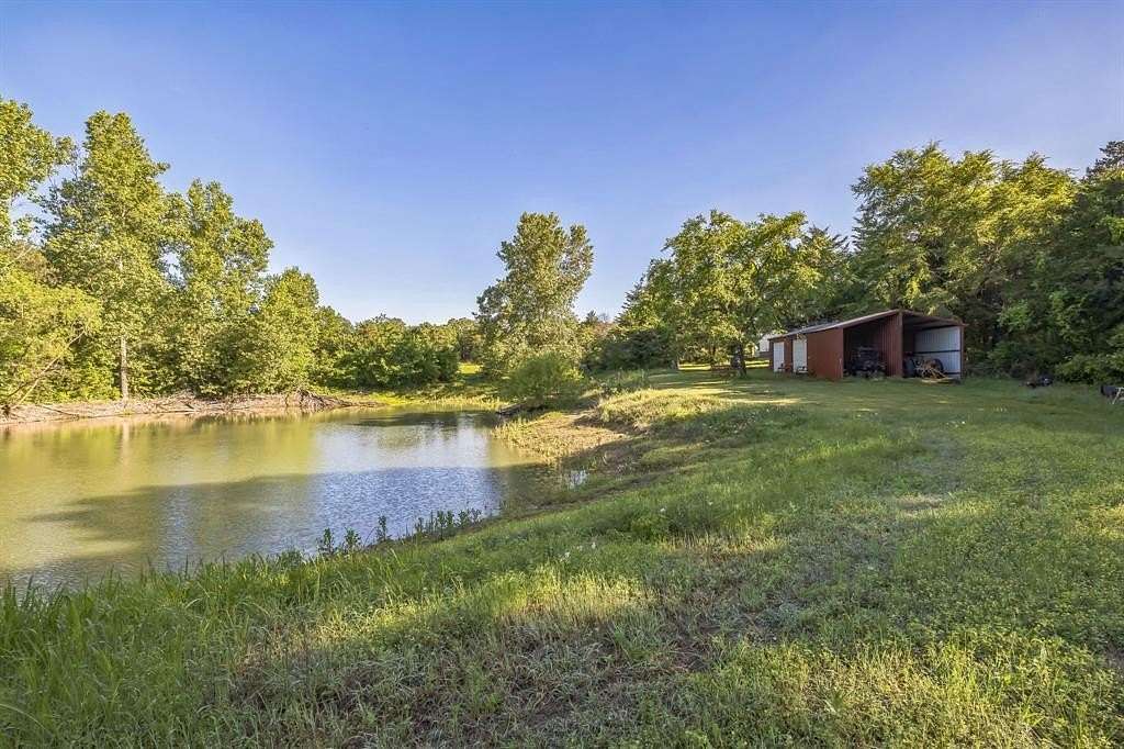 10 Acres of Residential Land with Home for Sale in Honey Grove, Texas