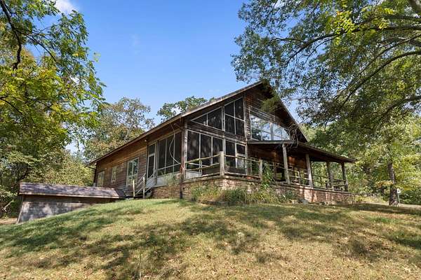 10.6 Acres of Land with Home for Sale in Versailles, Kentucky