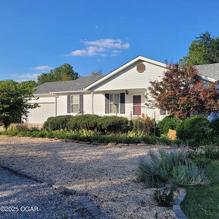 0.8 Acres of Residential Land with Home for Sale in Webb City, Missouri