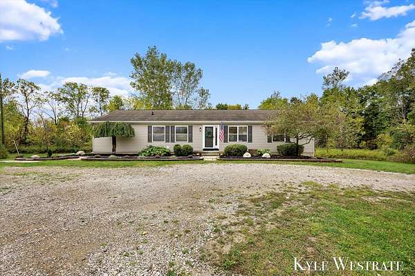 3.5 Acres of Residential Land with Home for Sale in Lowell, Michigan