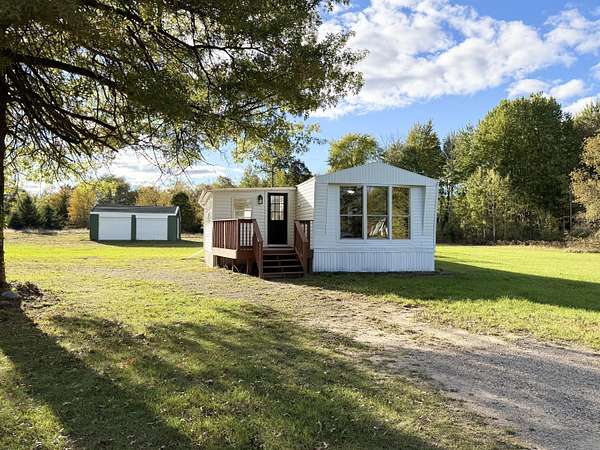 1.68 Acres of Residential Land with Home for Sale in Sand Lake, Michigan