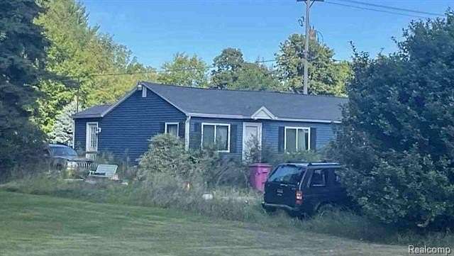 1.78 Acres of Residential Land with Home for Auction in Owosso, Michigan