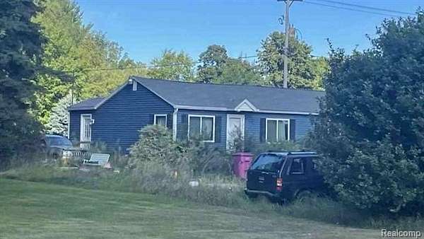1.78 Acres of Residential Land with Home for Auction in Owosso, Michigan