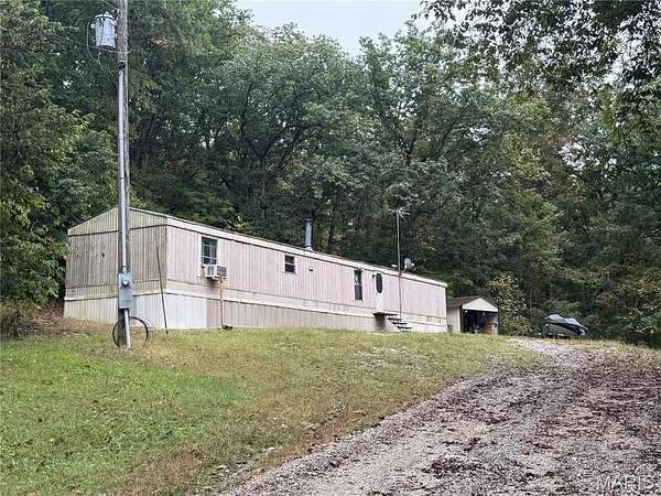 3 Acres of Residential Land with Home for Sale in Center, Missouri