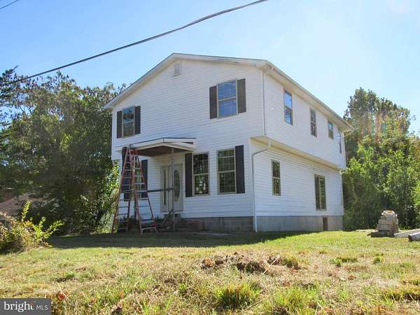 1.5 Acres of Residential Land with Home for Auction in Huntingtown, Maryland