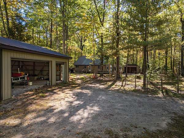 3 Acres of Residential Land with Home for Sale in Indian River, Michigan