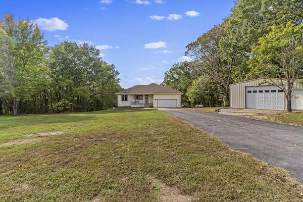 6.69 Acres of Residential Land with Home for Sale in Clever, Missouri