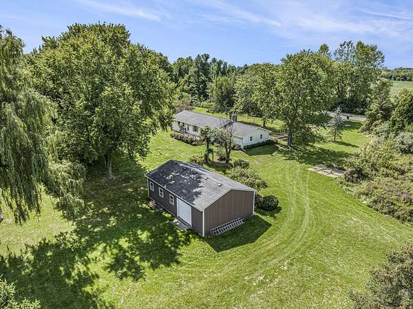 4 Acres of Residential Land with Home for Sale in Rockford, Michigan