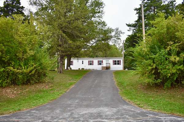 10 Acres of Land with Home for Sale in Rogersville, Missouri