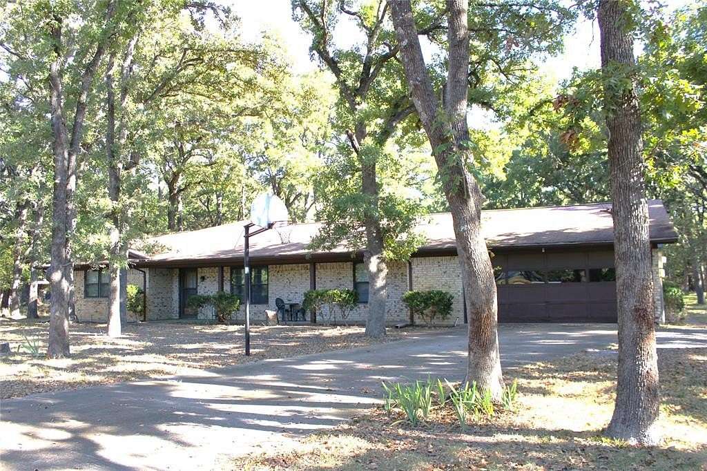 1.5 Acres of Residential Land with Home for Sale in Quinlan, Texas