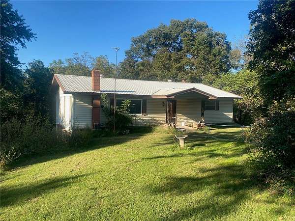 4.8 Acres of Land with Home for Sale in Seligman, Missouri