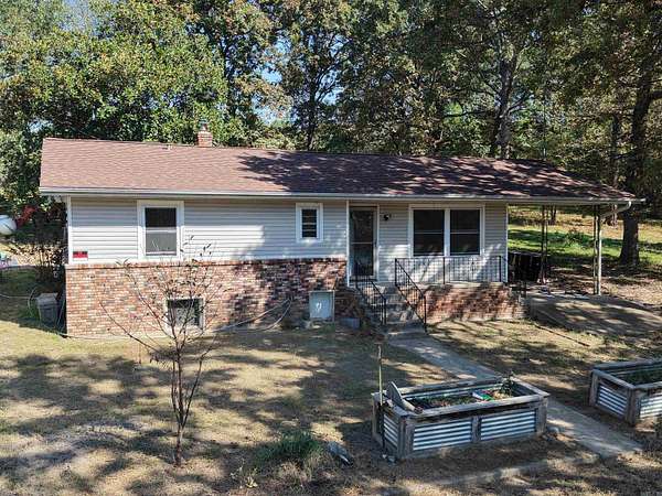 9 Acres of Residential Land with Home for Sale in Gassville, Arkansas