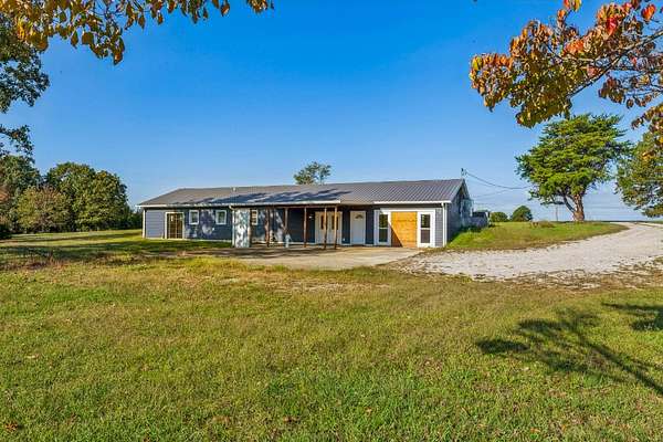 4 Acres of Residential Land with Home for Sale in Bon Aqua, Tennessee