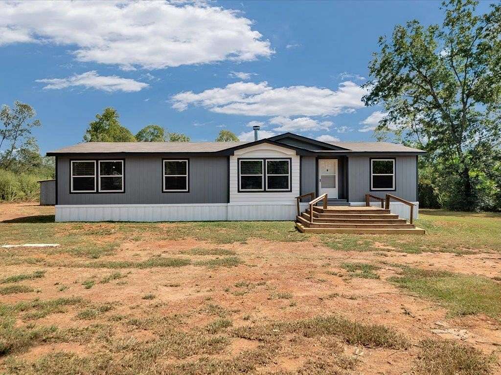 1.73 Acres of Residential Land with Home for Sale in Laneville, Texas