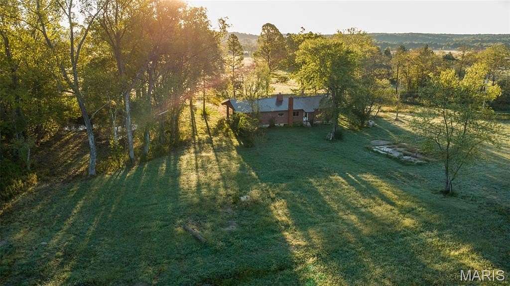 15.3 Acres of Land with Home for Sale in Poplar Bluff, Missouri