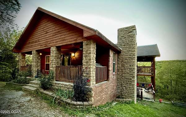 5 Acres of Residential Land with Home for Sale in Kissee Mills, Missouri