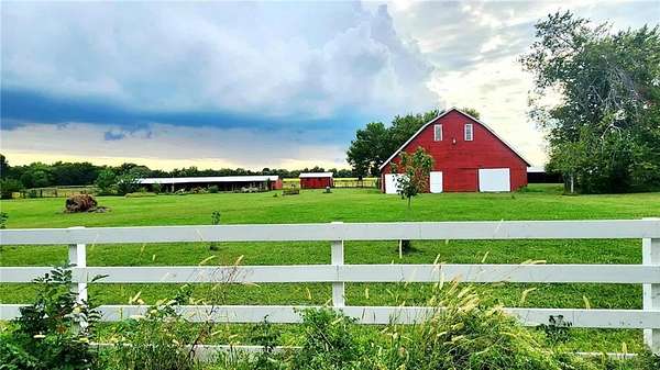 81.4 Acres of Agricultural Land with Home for Sale in Girard, Kansas