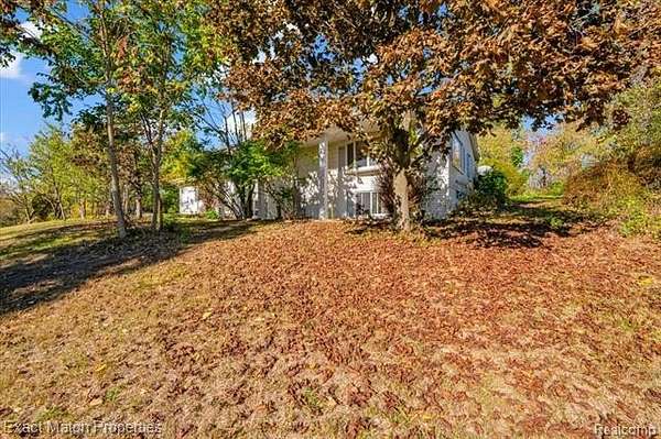 2.5 Acres of Residential Land with Home for Sale in White Lake, Michigan