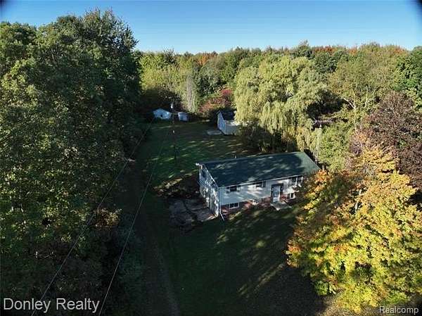 26.2 Acres of Recreational Land with Home for Sale in Clifford, Michigan