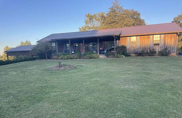 9.84 Acres of Residential Land with Home for Sale in Clifton, Tennessee