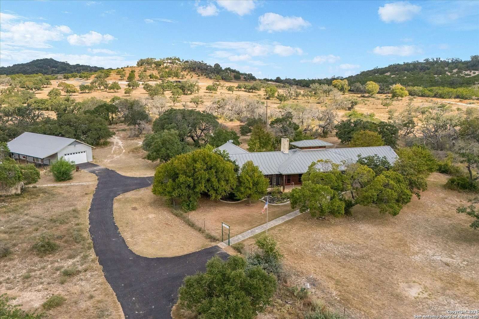 31.8 Acres of Agricultural Land with Home for Sale in Comfort, Texas