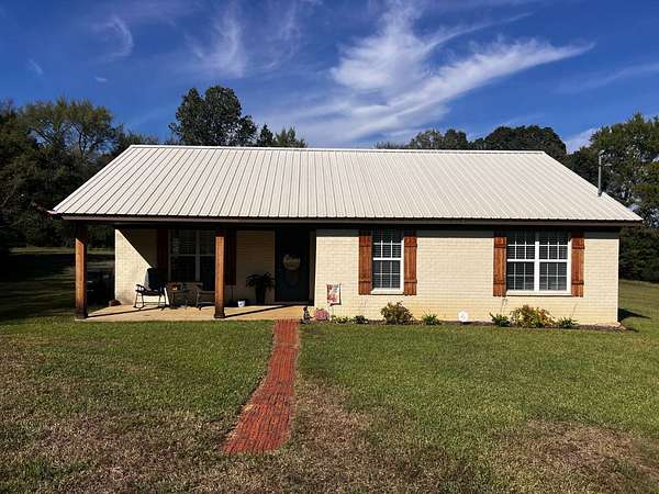 4.9 Acres of Residential Land with Home for Sale in Coldwater, Mississippi