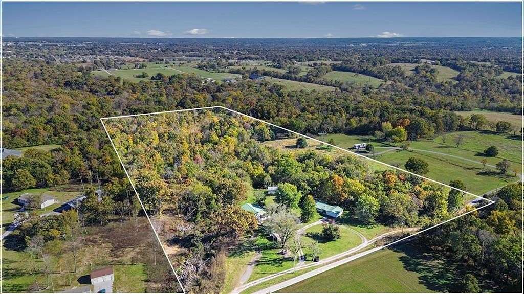 20 Acres of Land with Home for Sale in Gravette, Arkansas