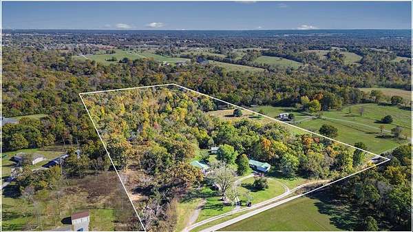 20 Acres of Land with Home for Sale in Gravette, Arkansas