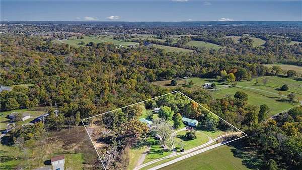 5 Acres of Land with Home for Sale in Gravette, Arkansas