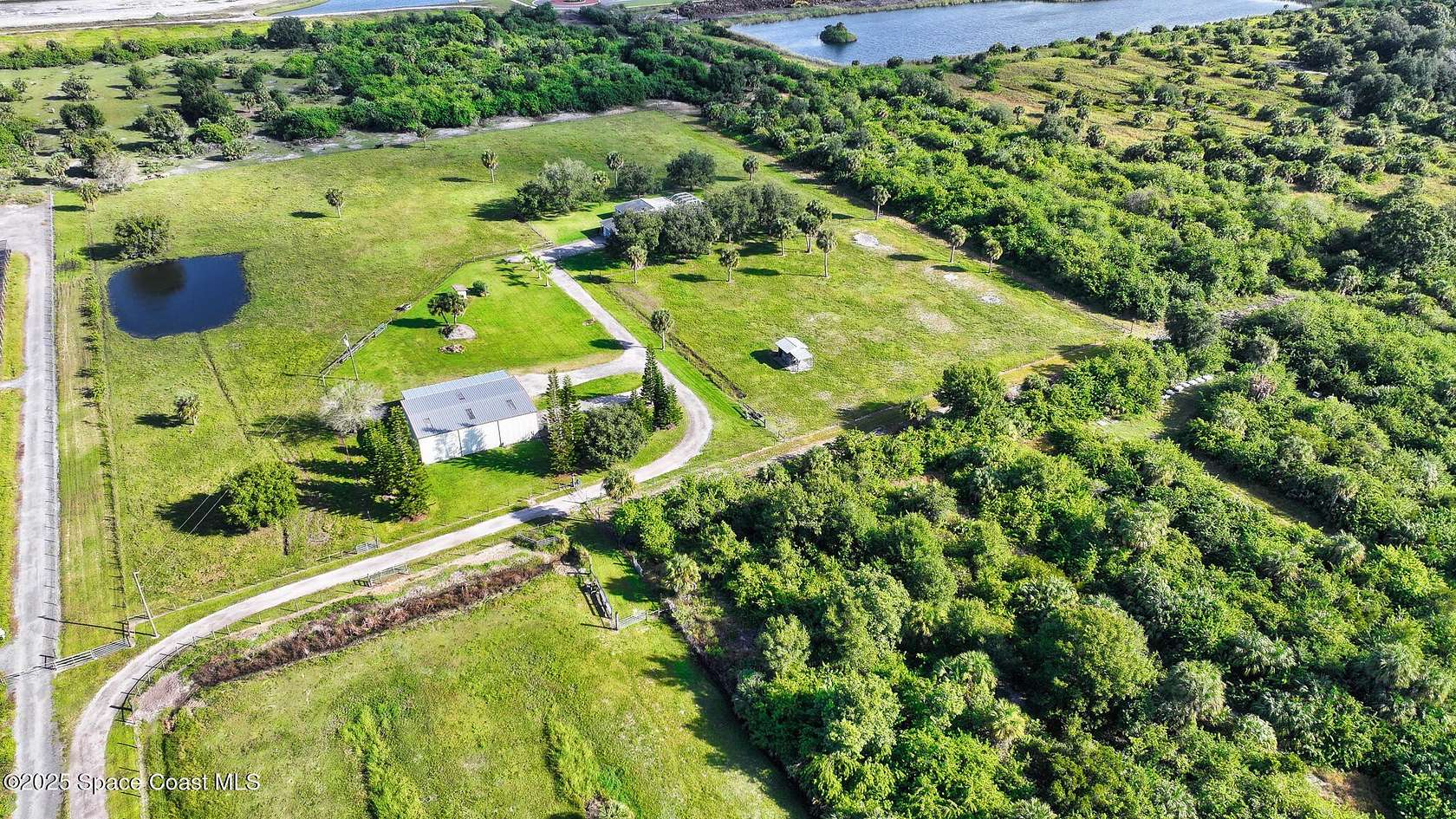 9.66 Acres of Land with Home for Sale in Palm Bay, Florida