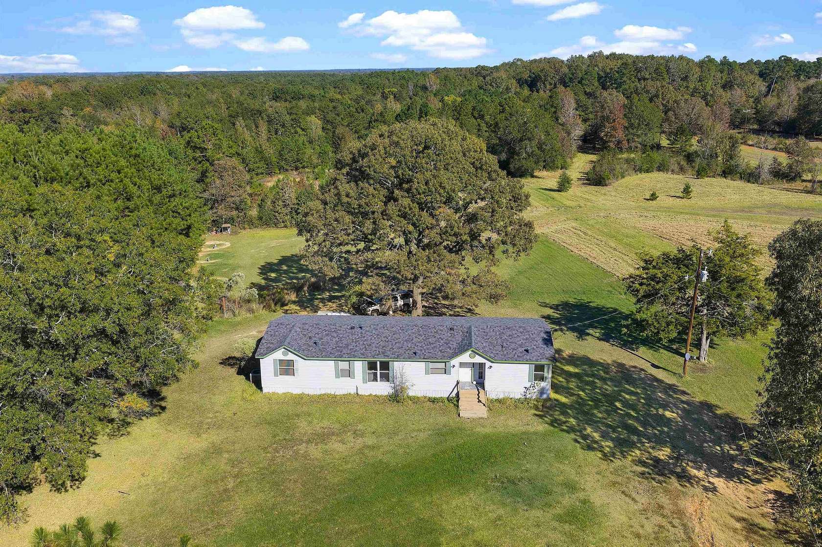 13.5 Acres of Land with Home for Sale in Beckville, Texas