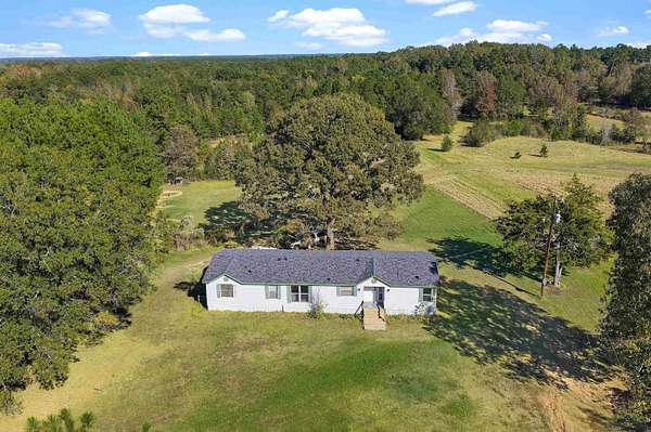 13.5 Acres of Land with Home for Sale in Beckville, Texas