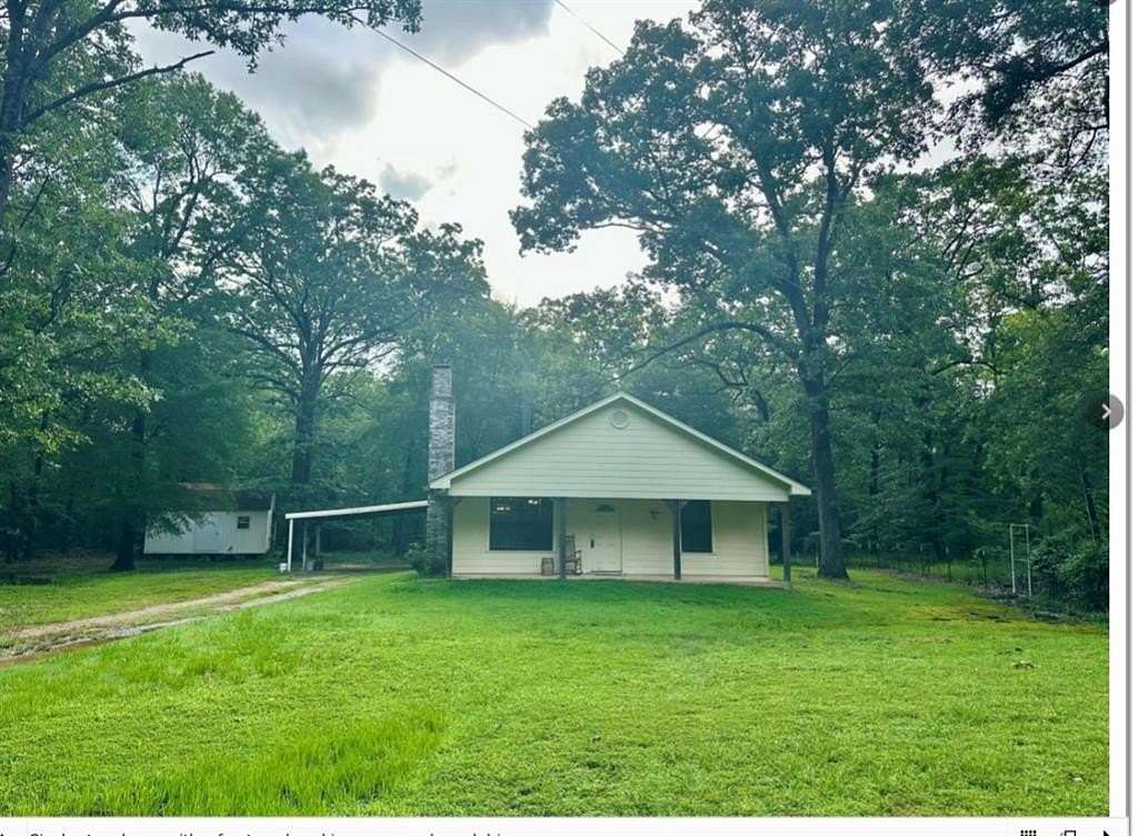 33.5 Acres of Recreational Land with Home for Sale in Powderly, Texas