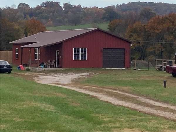 1.5 Acres of Residential Land with Home for Sale in Green Forest, Arkansas