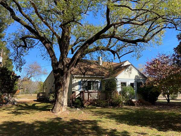 3.2 Acres of Residential Land with Home for Auction in Topping, Virginia