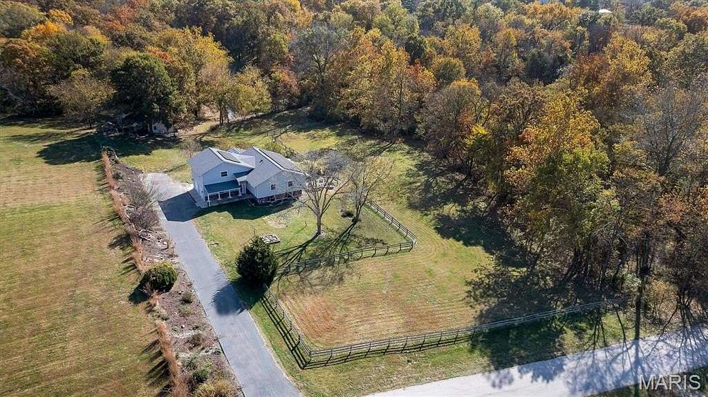 3.64 Acres of Residential Land with Home for Sale in Harvester Township, Missouri