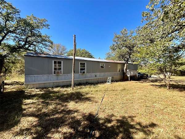1.89 Acres of Residential Land with Home for Sale in Millsap, Texas