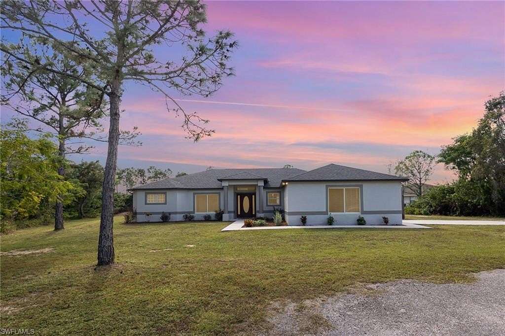 2 Acres of Residential Land with Home for Sale in Lehigh Acres, Florida