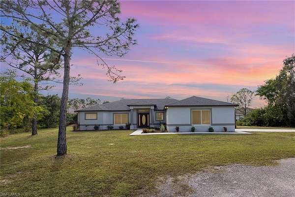 2 Acres of Residential Land with Home for Sale in Lehigh Acres, Florida